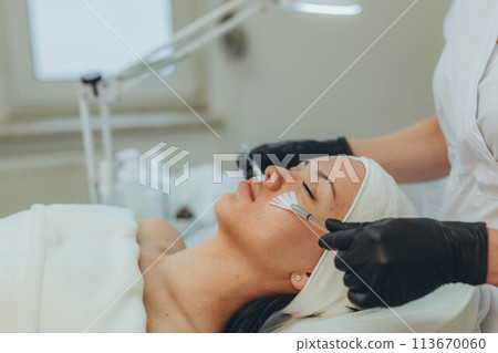 A girl at a cosmetologist does cosmetic procedures. Skin cleansing A girl at a cosmetologist does cosmetic procedures. Skin cleansing 113670060