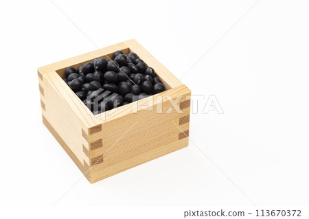 Black soybeans on white background 113670372