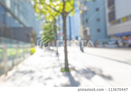 Blurred background of business district in early summer 113670447