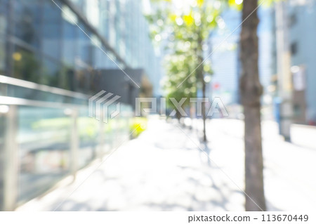 Blurred background of business district in early summer Blurred background of business district in early summer 113670449