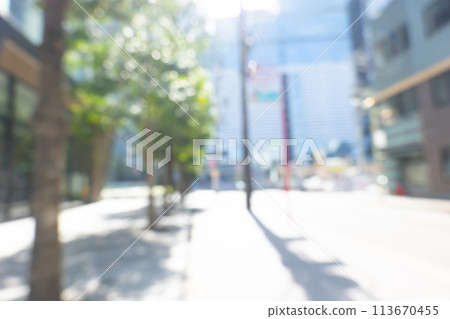 Blurred background of business district in early summer Blurred background of business district in early summer 113670455