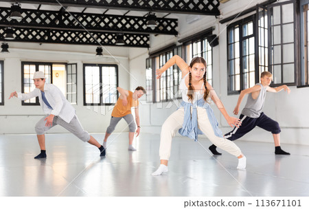 Teenagers training contemporary dance at studio 113671101