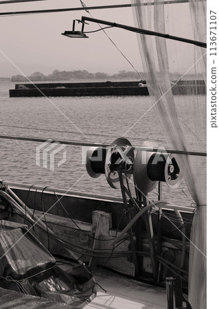 Fishing boat anchored at the fishing port Fishing boat anchored at the fishing port 113671107