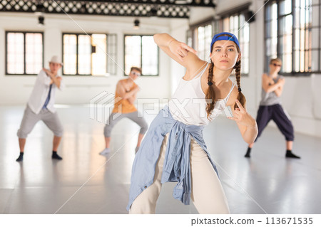 Girl training hip hop at group class Girl training hip hop at group class 113671535