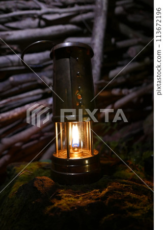 Camping at Lake Kawaguchi, Mt. Fuji in Japan. Beautiful warm light oil lamps, gasoline lanterns and logs. 113672196