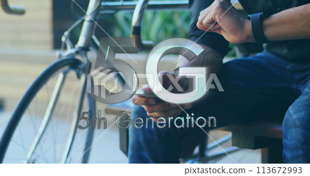 Image of 5g 5th generation text over man using smartphone in background 113672993