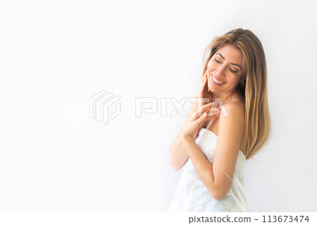 Beautiful gorgeous woman looking at camera isolated on white. Beauty healthy facial skin care 113673474