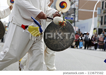 people in traditional costumes dance event 113675582