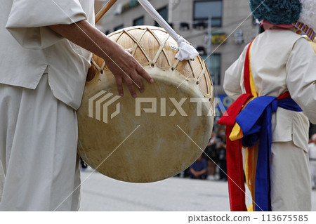 people in traditional costumes dance event 113675585