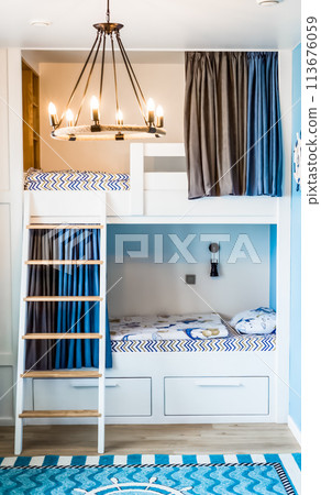 Blue curtains for bunk bed for boys in the bedroom without people 113676059
