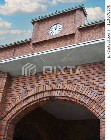 Ant's-Eye View of a clock on top of a building. Picture for use in illustrations Background image or copy space 113676879