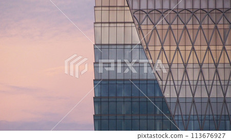 Abstract architecture background, minimalist top of building detail against blue sky for use as art, background or copyspace 113676927