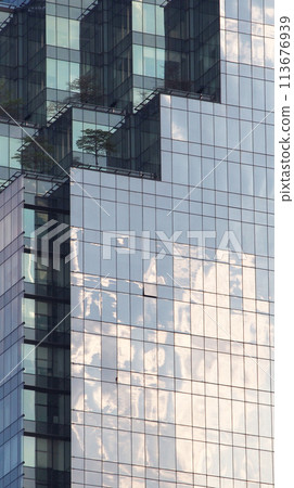 Abstract architecture background, minimalist top of building detail against blue sky for use as art, background or copyspace Abstract architecture background, minimalist top of building detail against blue sky for use as art, background or copyspace 113676939