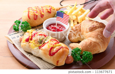 Junk food (sausage rolls, croissants, corn dogs and french fries) Junk food (sausage rolls, croissants, corn dogs and french fries) 113677671