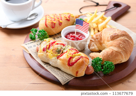 Junk food (sausage rolls, croissants, corn dogs and french fries) Junk food (sausage rolls, croissants, corn dogs and french fries) 113677679