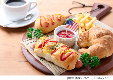 Junk food (sausage rolls, croissants, corn dogs and french fries) Junk food (sausage rolls, croissants, corn dogs and french fries) 113677680