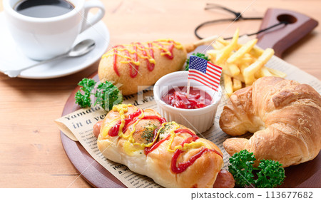 Junk food (sausage rolls, croissants, corn dogs and french fries) Junk food (sausage rolls, croissants, corn dogs and french fries) 113677682