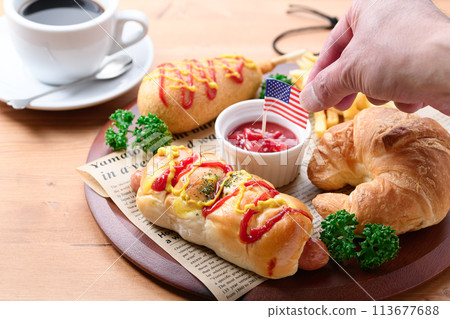 Junk food (sausage rolls, croissants, corn dogs and french fries) Junk food (sausage rolls, croissants, corn dogs and french fries) 113677688