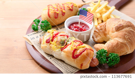 Junk food (sausage rolls, croissants, corn dogs and french fries) 113677691