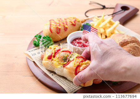 Junk food (sausage rolls, croissants, corn dogs and french fries) Junk food (sausage rolls, croissants, corn dogs and french fries) 113677694