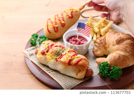 Junk food (sausage rolls, croissants, corn dogs and french fries) Junk food (sausage rolls, croissants, corn dogs and french fries) 113677701