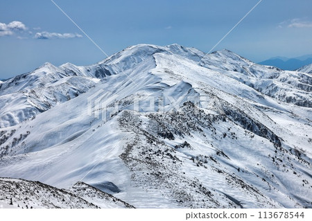 The snow-capped ridgeline leading from Mt. Makihata to the Tanigawa mountain range The snow-capped ridgeline leading from Mt. Makihata to the Tanigawa mountain range 113678544
