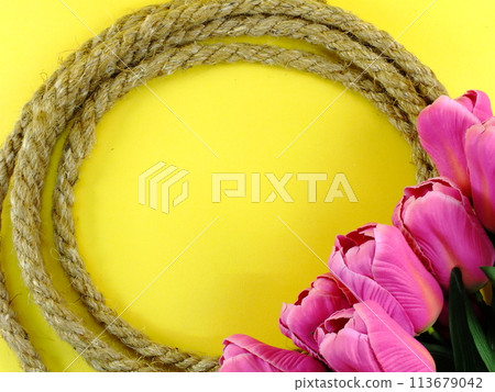 space background for copy with robe border and artificial tulip flowers decor space background for copy with robe border and artificial tulip flowers decor 113679042
