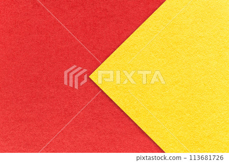 Texture of red paper background, half two colors with yellow arrow, macro. Vintage craft cardboard. 113681726