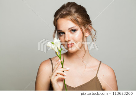 Young beautiful woman on white background Young beautiful woman on white background 113683260