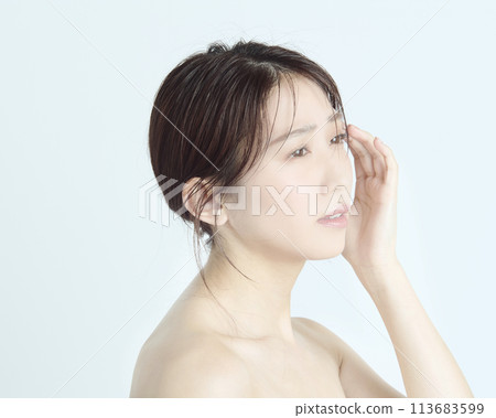 Close-up upper body portrait of a young woman on a white background 113683599