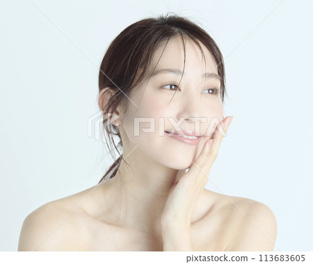 Close-up upper body portrait of a young woman on a white background 113683605
