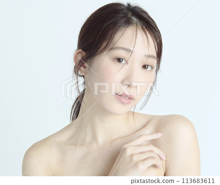 Close-up upper body portrait of a young woman on a white background Close-up upper body portrait of a young woman on a white background 113683611