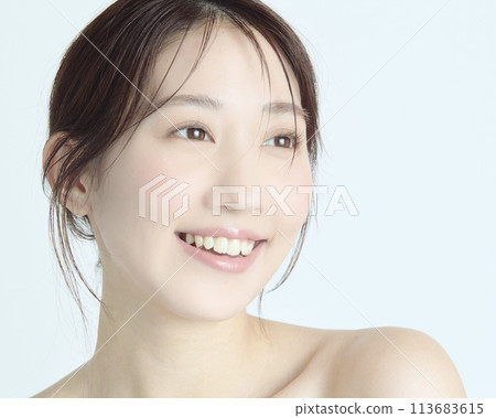 Close-up upper body portrait of a young woman on a white background Close-up upper body portrait of a young woman on a white background 113683615