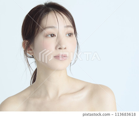 Close-up upper body portrait of a young woman on a white background Close-up upper body portrait of a young woman on a white background 113683618