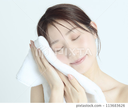 Close-up upper body portrait of a young woman on a white background Close-up upper body portrait of a young woman on a white background 113683626