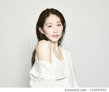 Portrait of a young woman on a white background with a summer image 113683650