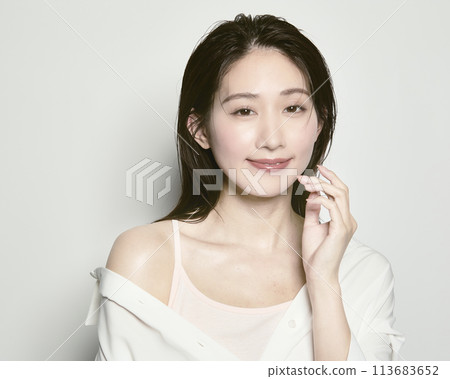 Portrait of a young woman on a white background with a summer image 113683652
