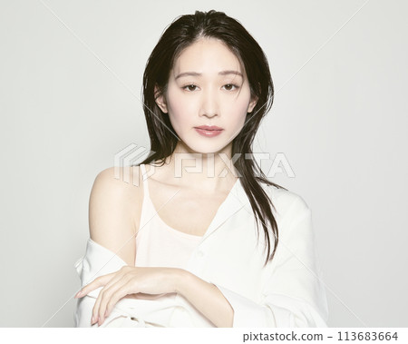 Portrait of a young woman on a white background with a summer image 113683664