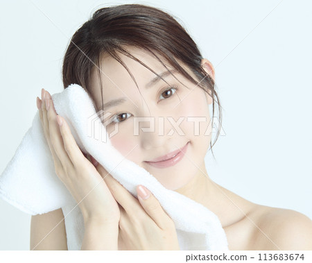 Close-up upper body portrait of a young woman on a white background 113683674
