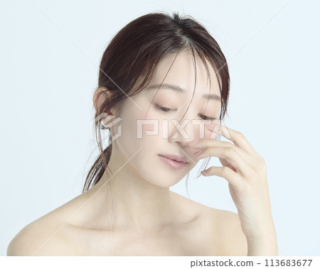 Close-up upper body portrait of a young woman on a white background 113683677