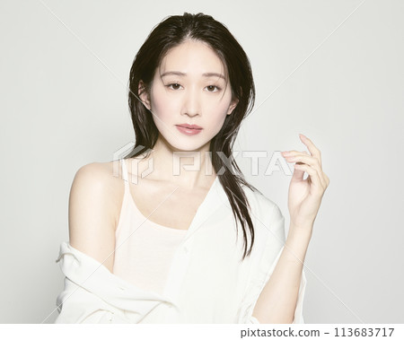Portrait of a young woman on a white background with a summer image 113683717