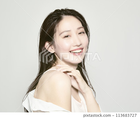 Portrait of a young woman on a white background with a summer image Portrait of a young woman on a white background with a summer image 113683727