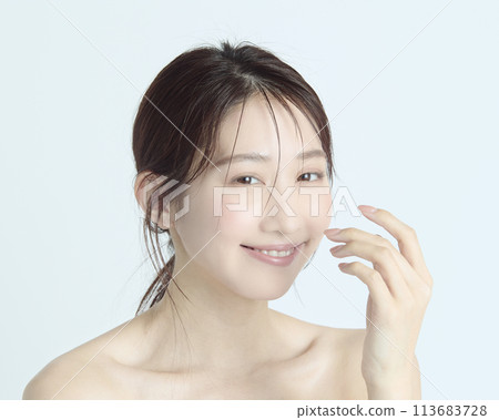 Close-up upper body portrait of a young woman on a white background Close-up upper body portrait of a young woman on a white background 113683728