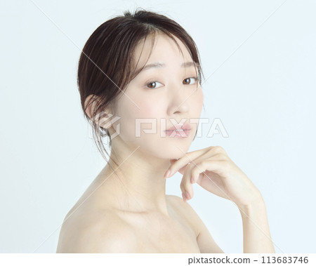 Close-up upper body portrait of a young woman on a white background Close-up upper body portrait of a young woman on a white background 113683746