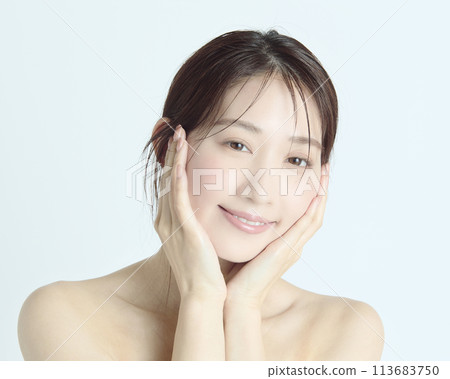 Close-up upper body portrait of a young woman on a white background Close-up upper body portrait of a young woman on a white background 113683750
