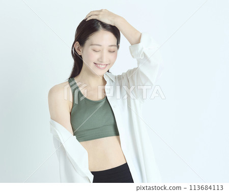 Portrait of a healthy young woman on white background 113684113