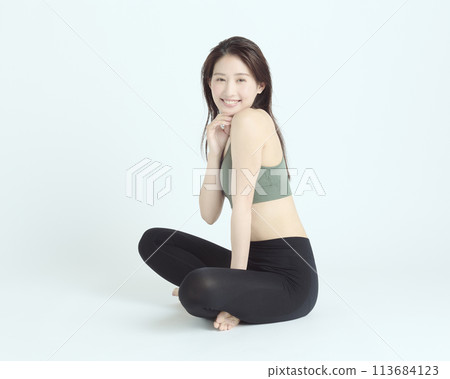 Portrait of a healthy young woman on white background 113684123