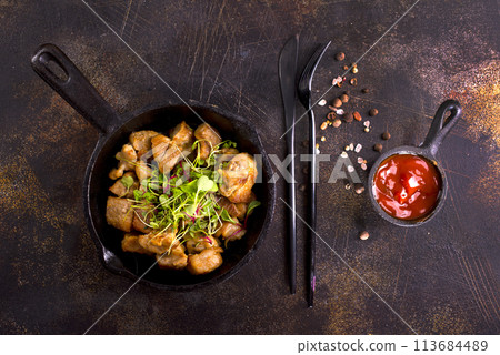 fried meat in pan, fried meat with salt and spice 113684489