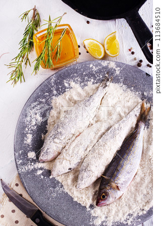 Fillet fish coated in flour. Home cooked fish fillet. 113684510