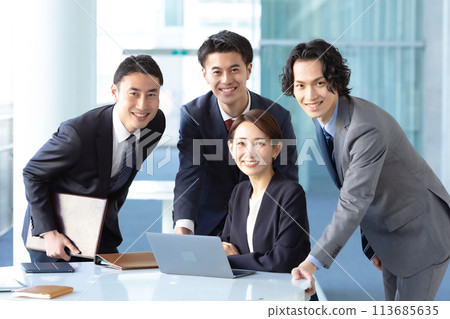 Business men and women looking at camera 113685635